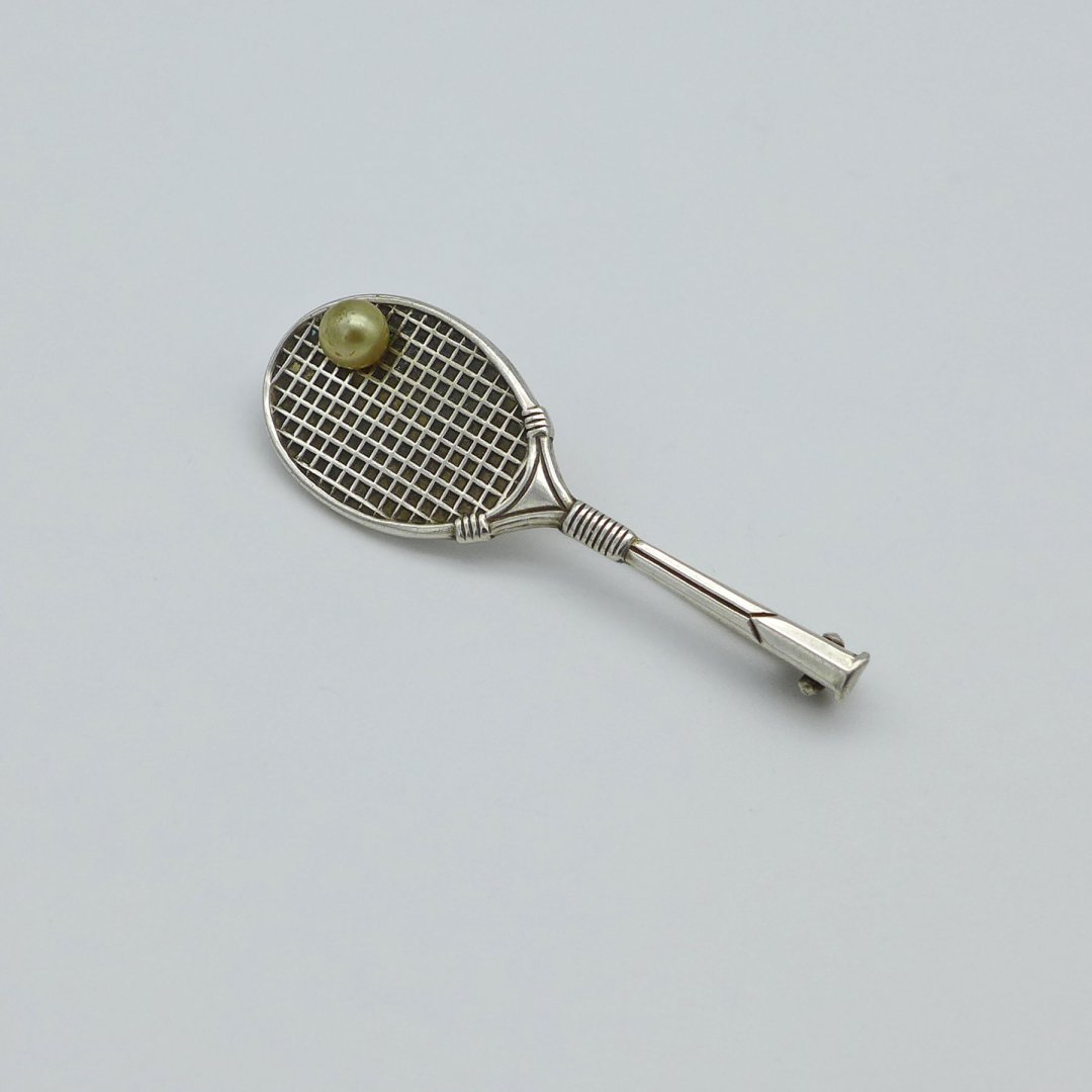 Brooch tennis racket