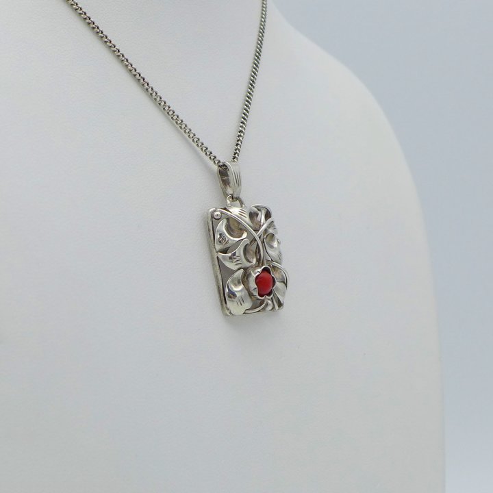 Handmade pendant with tendril motif and coral
