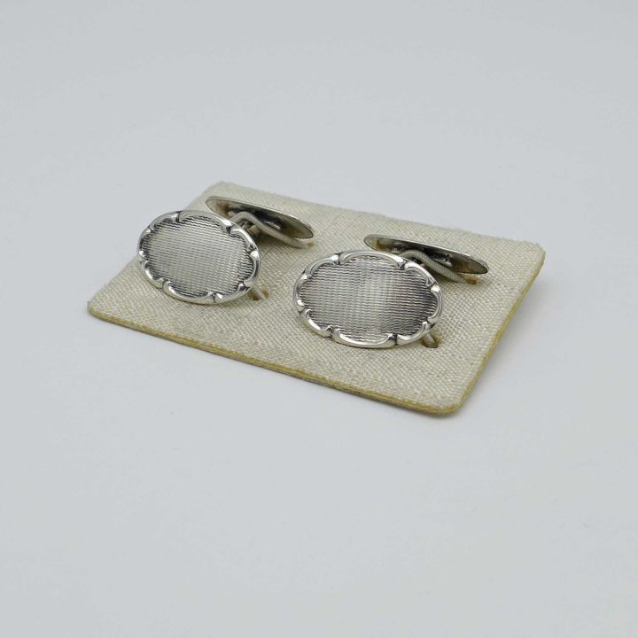 Silver cufflinks with baroque decoration