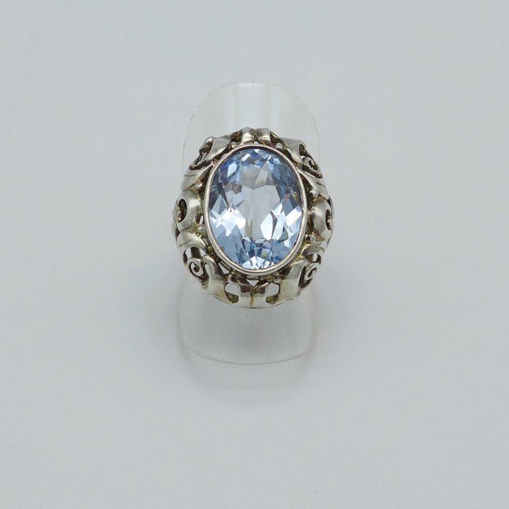 Oval silver ring with light blue stone