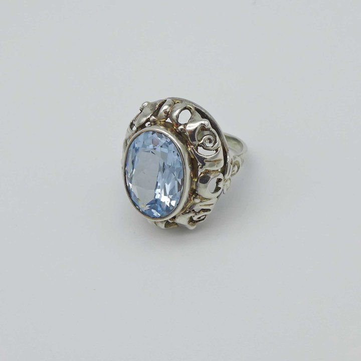 Oval silver ring with light blue stone