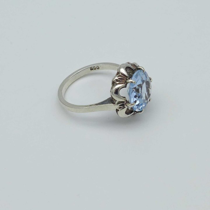 Delicate silver ring with light blue stone