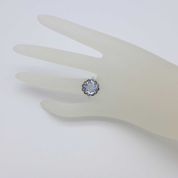 Delicate silver ring with light blue stone