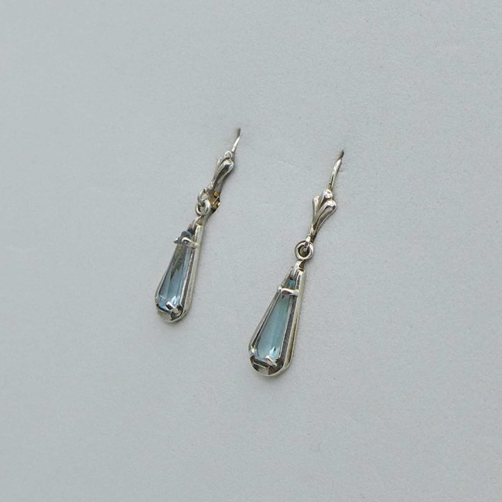 Earrings with light blue stone