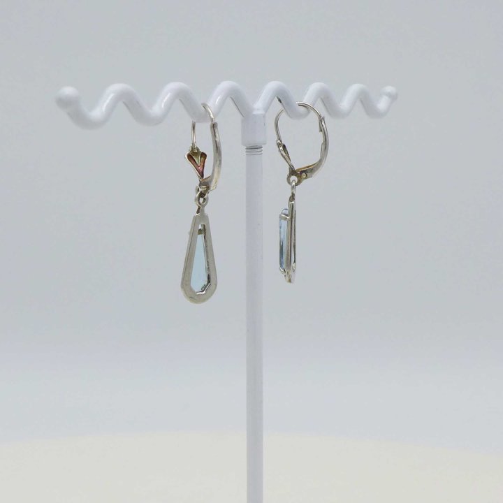 Earrings with light blue stone
